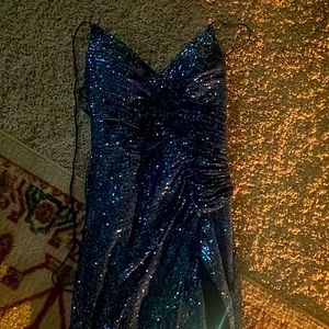 This Aria Bridal and Formal Wear medium sized blue sequin long backless dress